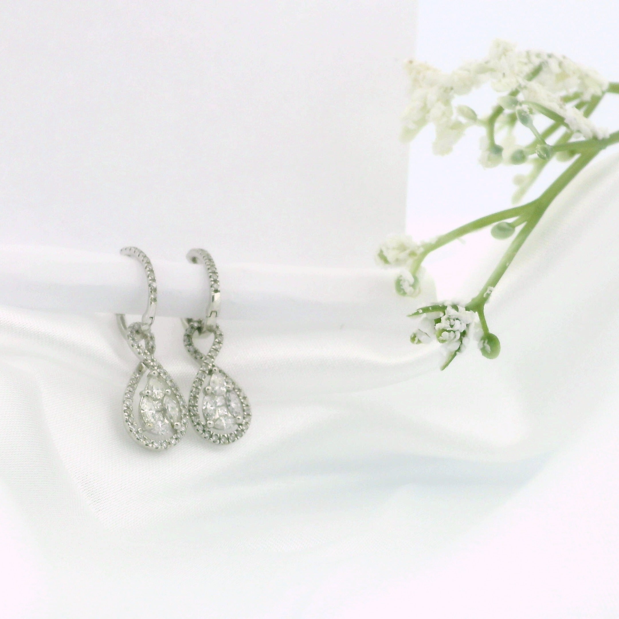 14k White Gold Diamond Hoop Earrings with Oval Swirl Dangle